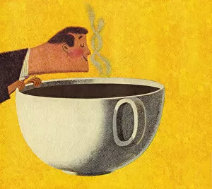 Man Smelling Giant Cup of Coffee