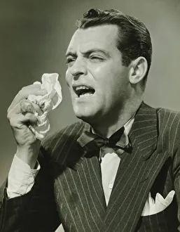 35 39 Years Collection: Man sneezing in studio, (B&W)