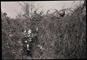 Man and Son Looking at Pheasant
