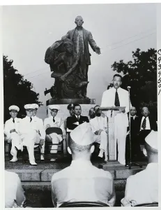 Speaking Prints: Man Speaking At Dedication Of School