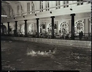 Resort Prints: Man Splashes Around In Resort Pool