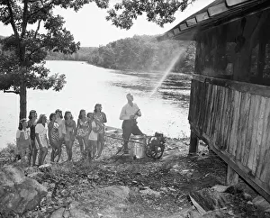 Spraying Prints: Man Spraying A Camp Building With Ddt