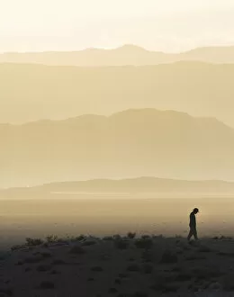 Images Dated 13th August 2015: Man standing in desert silhouette