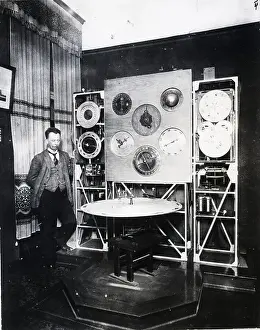 Artisan Prints: Man Standing Next to Detailed Clock