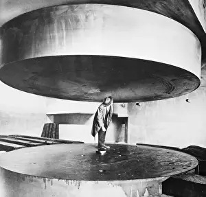 Disc Prints: Man Standing Between Two Huge Discs