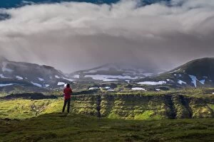 Images Dated 16th June 2014: a man standing in front of iceland mountain landscape