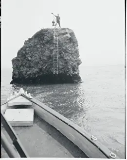Landforms Prints: Man Standing on Pillar Rock