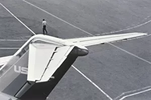 Henri Silberman Collection Gallery: Man standing on tail of plane