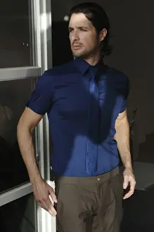 Spare Prints: Man standing at a window, fashion shot