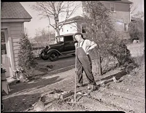 Overalls Prints: Man Stands with Rake Near Garden