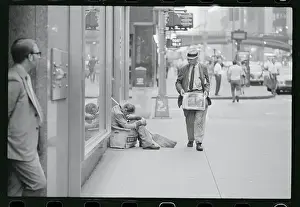 Man Strolling Down a Sidewalk
