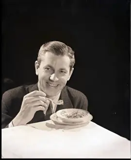 Breakfast Prints: Man in Suit Eating Bowl of Cereal