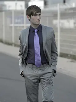 Suit Prints: Man in suit in an industrial area
