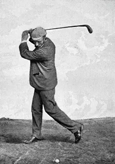 Man Swinging Golf Club