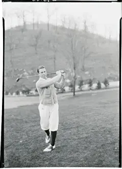 Man Swinging a Golf Club