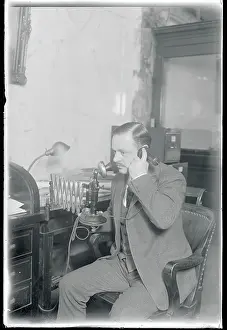 Man Talking on Telephone