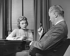 50 59 Years Prints: Man talking to woman who is taking notes