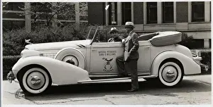Man Talks To Driver Of 1935 Cadillac