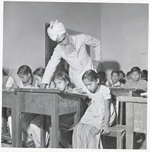 Man Teaching Youngsters in Classroom