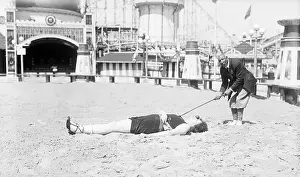 Challenge Prints: Man Teeing Off from Nose of Woman