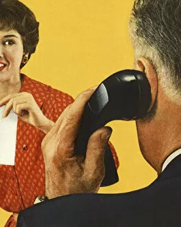 Images Dated 6th June 2013: Man on the Telephone and a Woman Watching