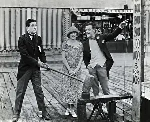 Announcer Prints: Man Testing Strength at Beach Movie Still