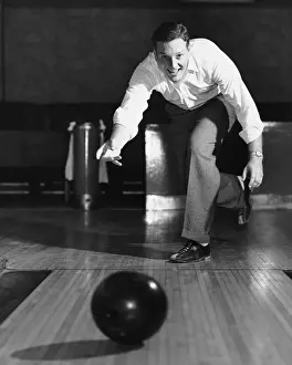 Bowling Alley Prints: Man throwing bowling ball down lane
