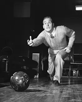 Bowling Alley Prints: Man throwing bowling ball down lane