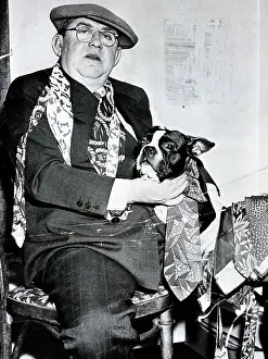 Picking Prints: Man Trying Ties On Dog