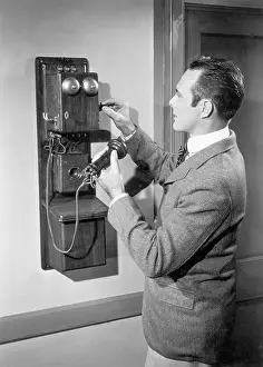 Telephone Prints: Man Using Old Fashioned Telephone