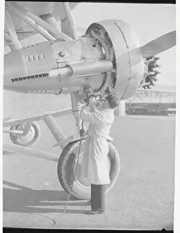 Burbank Prints: Man Using Portable Airplane Starting Device