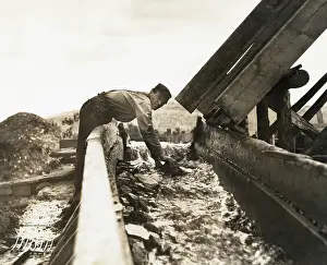 Man Using Trough To Wash Gold From Earth