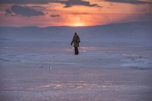 Images Dated 15th March 2015: a man walking on a frozen lake Baikal