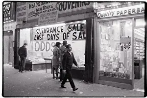 42nd Street Prints: Man Walking Past Clearance Sale at Store
