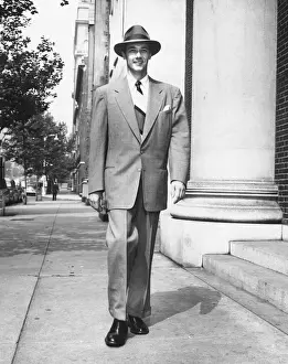 Man walking on sidewalk, (B&W)