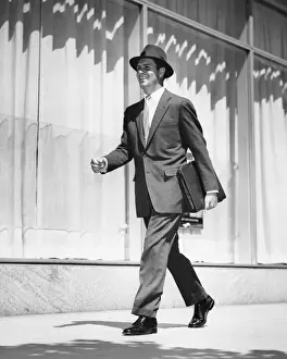 Briefcase Prints: Man walking on street