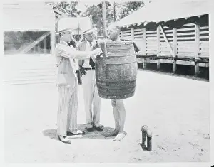 Man Wearing a Barrel