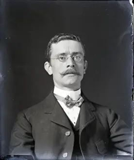 Man Wearing Glasses And Stern Expression