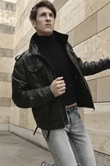 Man wearing a leather jacket, running