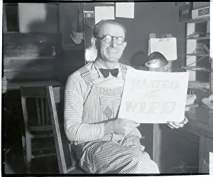 Despair Prints: Man Wearing Overalls Holding Sign Asking for a Wife