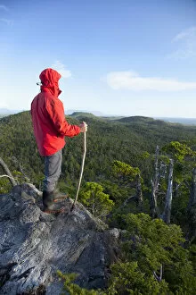 Images Dated 19th January 2012: A Man Wearing A Red Jacket Looks Out At The View Of Cox Bay Near Tofino