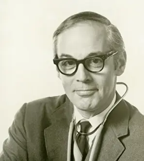 Stethoscope Prints: Man wearing stethoscope over suit, portrait