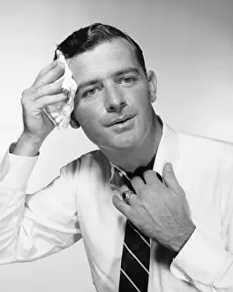 Necktie Prints: Man wiping forehead