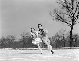 Leaning Prints: Man Woman Couple Pair Figure Skating On Ice Rink Smiling Costumes Arm In Arm Leaning Precision Glide Dance