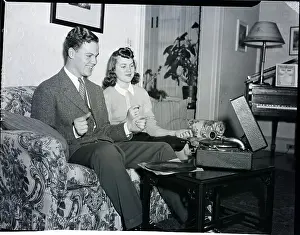 Man, Woman Listen To Phonograph