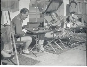 Man and Woman Playing Backgammon
