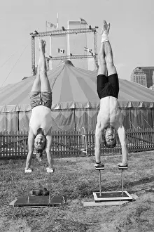 Man and Woman Practice Handstands