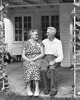 Side By Side Prints: Man and woman sitting on porch