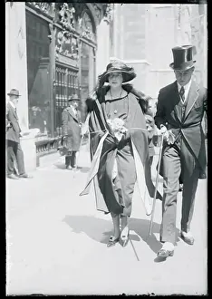 Man and Woman Strolling Down a Street