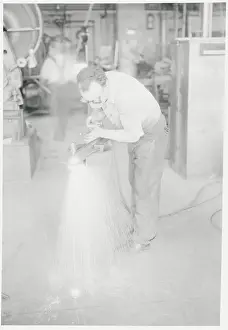 Assembling Prints: Man Working in Factory